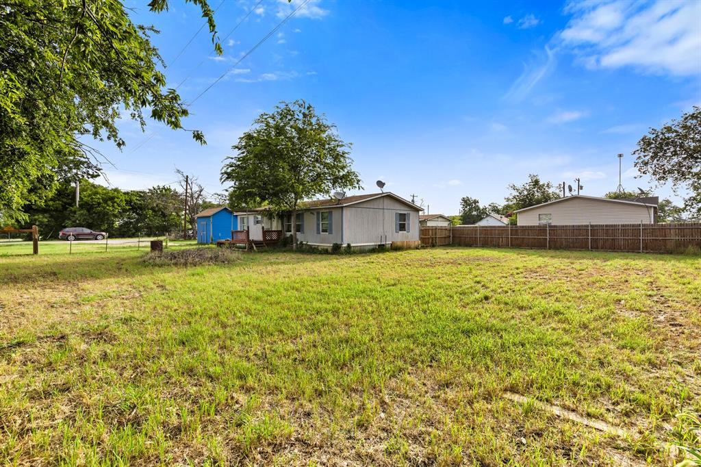 198 East 4th Street Crawford, TX 76638 - Photo 20 of 24 a view of a swimming pool with an outdoor space and seating area