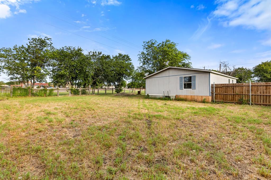 198 East 4th Street Crawford, TX 76638 - Photo 21 of 24 a view of a house with a yard