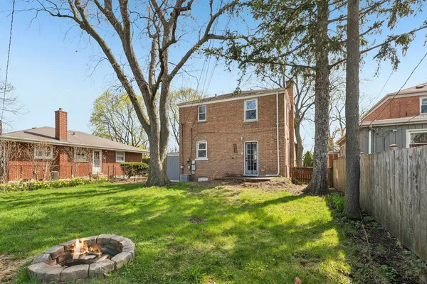 a house view with a sitting space and garden