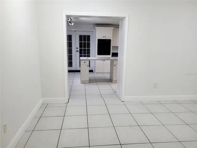 a view of a livingroom with an empty space and a sink