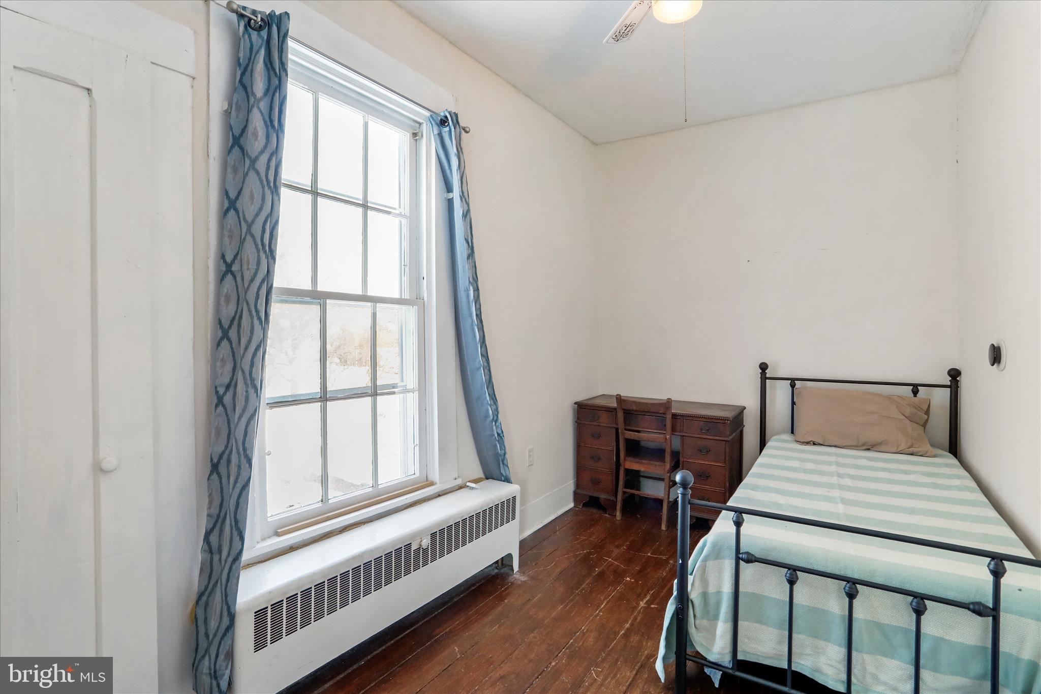 287 East Main Street Romney, WV 26757 - Photo 24 of 48 a bedroom with a bed and a window