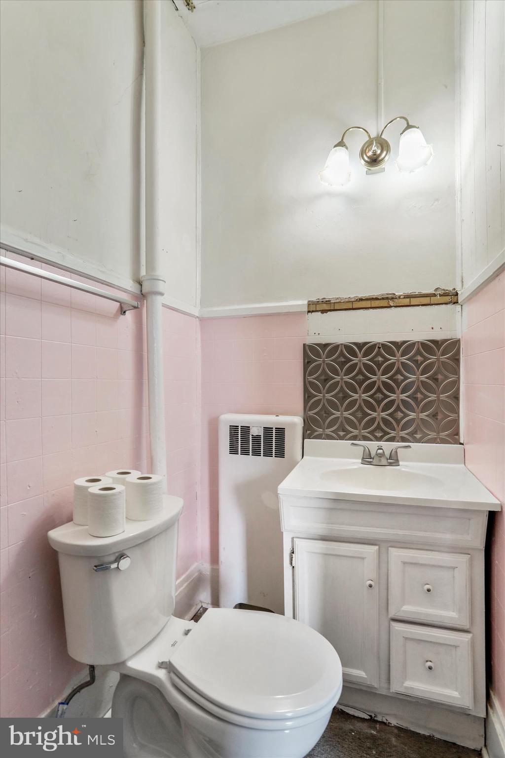 287 East Main Street Romney, WV 26757 - Photo 32 of 48 a bathroom with a sink a toilet and a mirror