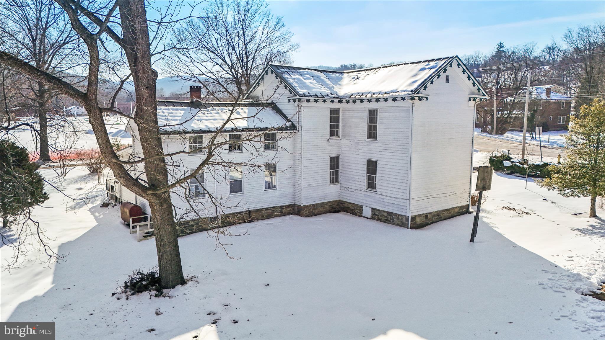 287 East Main Street Romney, WV 26757 - Photo 5 of 48 a view of a house with a snow in the yard