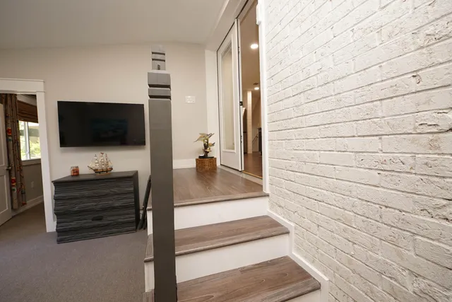 a view of living room with furniture and flat screen tv
