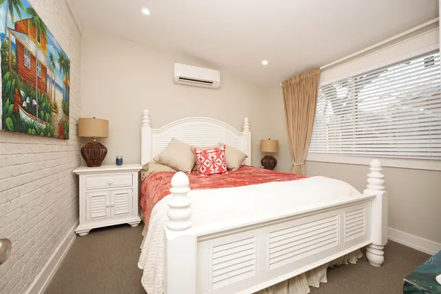 a bedroom with a bed and a cabinets