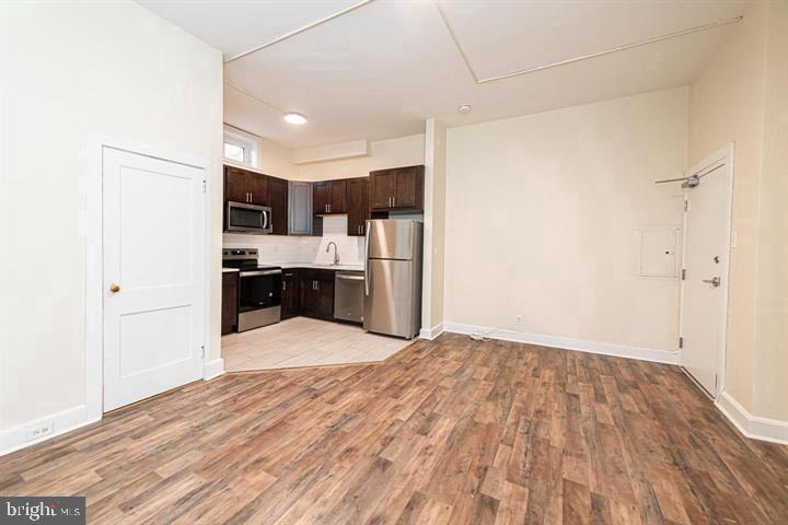 215 Bridge Street, Unit B Phoenixville, PA 19460 - Photo 11 of 31 a view of kitchen with wooden floor