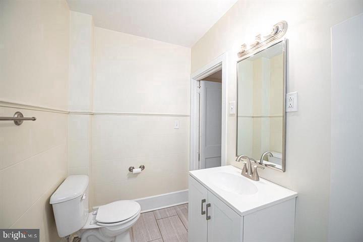 215 Bridge Street, Unit B Phoenixville, PA 19460 - Photo 14 of 31 a bathroom with a sink a toilet and shower