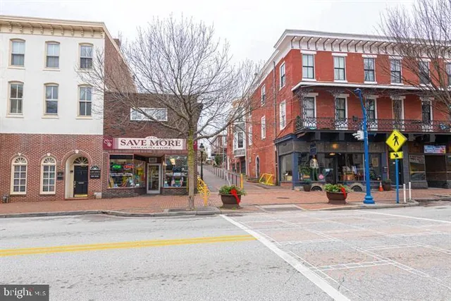 a view of a building with a people on a street