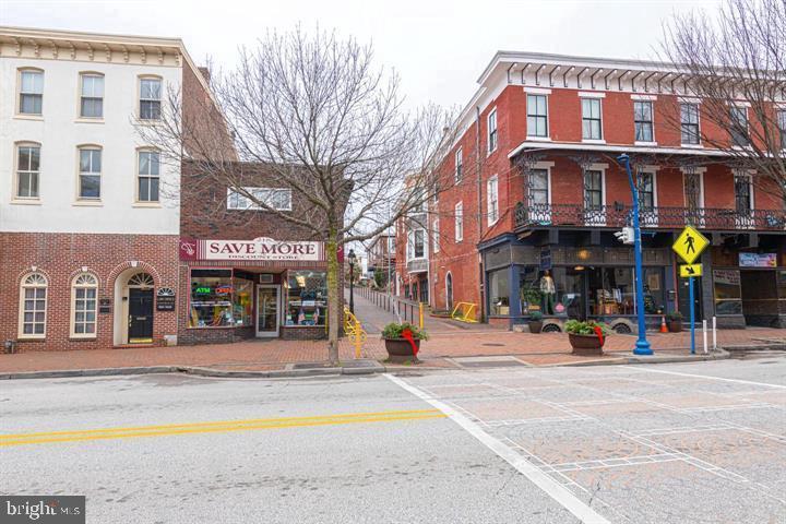 215 Bridge Street, Unit B Phoenixville, PA 19460 - Photo 2 of 31 a view of a building with a people on a street