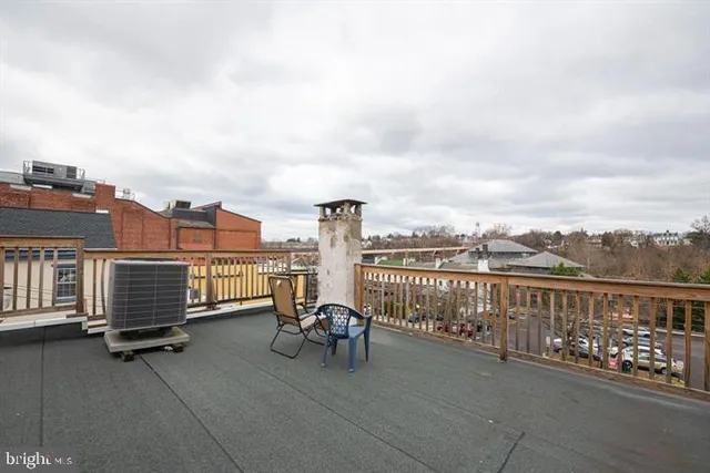 a view of roof deck with city view