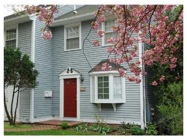 48 Pemberwick Road, Unit B Greenwich, CT 06831 - Photo 1 of 1 a front view of a house with a yard