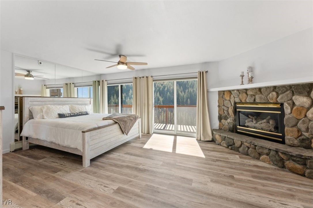 400 Fairview Boulevard, Unit 86 Incline Village, NV 89451 - Photo 13 of 36 a spacious bedroom with a bed and a fireplace