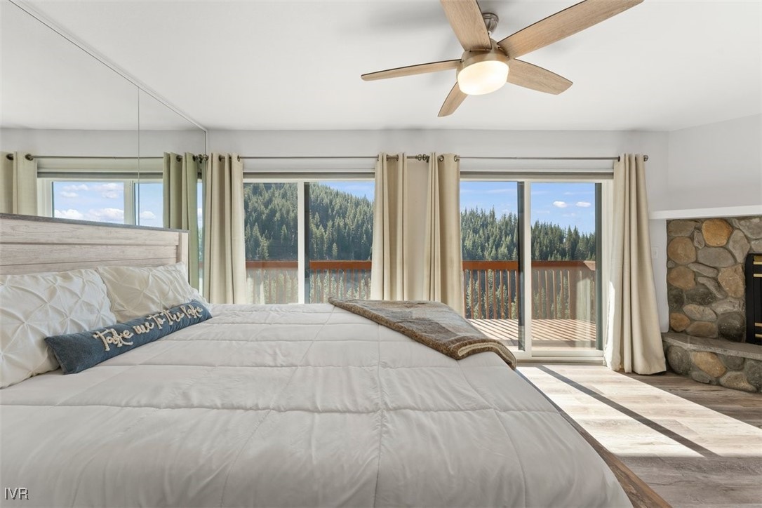 400 Fairview Boulevard, Unit 86 Incline Village, NV 89451 - Photo 16 of 36 a bedroom with a large bed and a large window with outer view