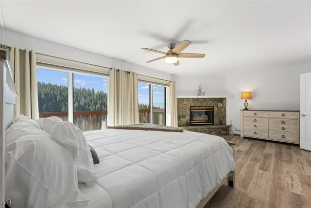 a large bedroom with a large bed and a tv