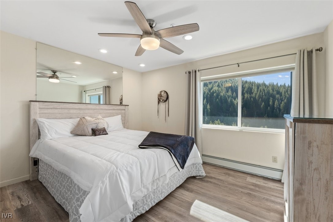 400 Fairview Boulevard, Unit 86 Incline Village, NV 89451 - Photo 23 of 36 a bedroom with a large bed and a large window with the outer view