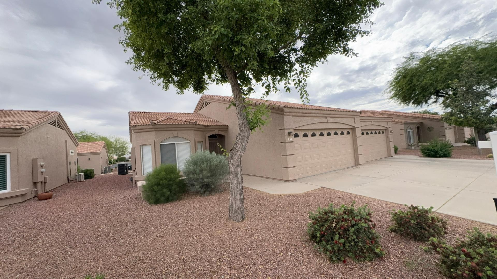 2101 South Yellow Wood, Unit 45 Mesa, AZ 85209 - Photo 10 of 10 a view of a house with a yard and garage