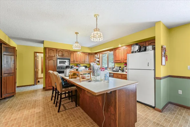 a kitchen with a sink stove and microwave