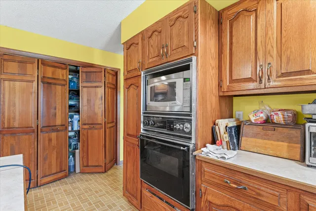 a bathroom with a sink toilet mirror vanity and shower