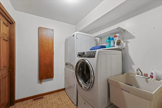 a bedroom with furniture and a flat screen tv