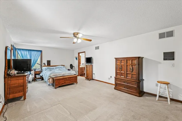 a bathroom with a sink toilet and mirror