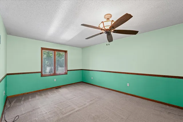 a view of a livingroom with furniture and windows