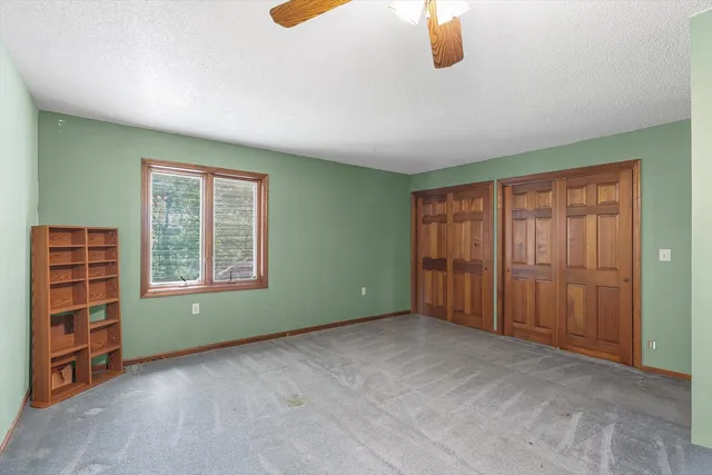 a bedroom with furniture and a bed