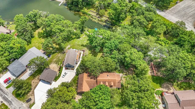 a view of a chairs and table in the backyard