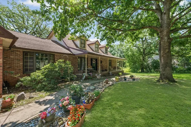 a front view of a house with garden