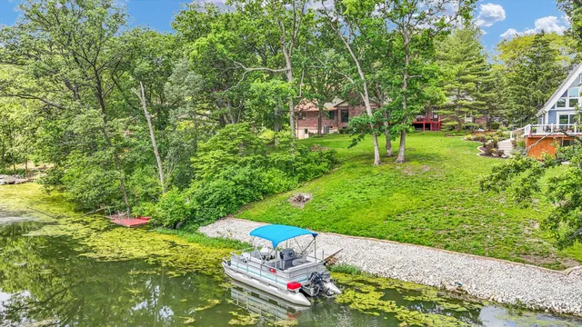 a green field with some trees in the background