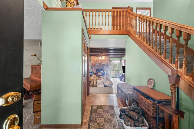 a view of a livingroom with furniture and a window