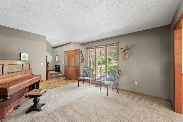 a view of a livingroom with furniture and workspace