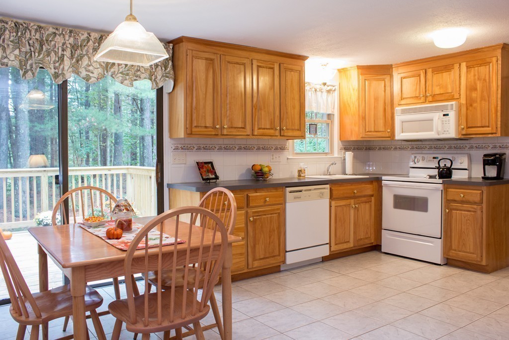 25 Green Valley Road Medway, MA 02053 - Photo 17 of 30 a kitchen that has a lot of white cabinets and stainless steel appliances