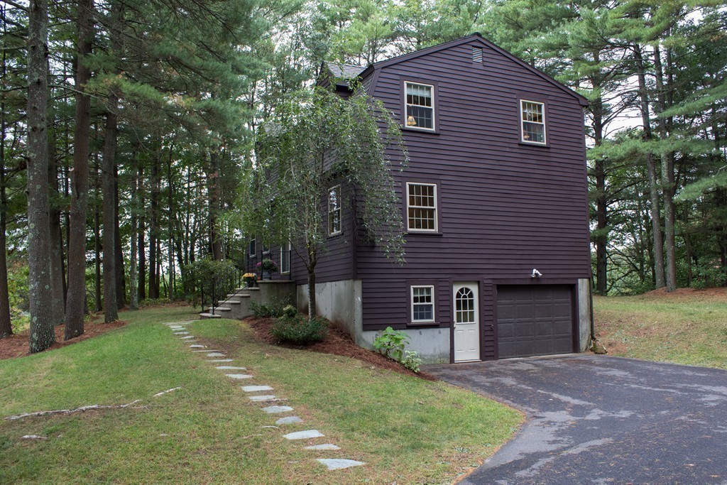 25 Green Valley Road Medway, MA 02053 - Photo 20 of 30 a front view of a house with a yard and trees