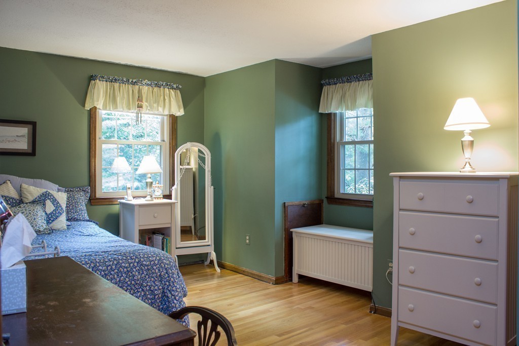 25 Green Valley Road Medway, MA 02053 - Photo 21 of 30 a bedroom with a bed and a dresser next to a window