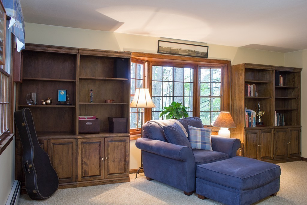 25 Green Valley Road Medway, MA 02053 - Photo 24 of 30 a living room with furniture cabinets and a window