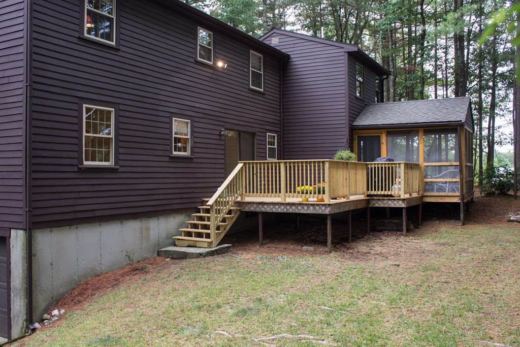 25 Green Valley Road Medway, MA 02053 - Photo 8 of 30 a backyard of a house with barbeque and wooden fence