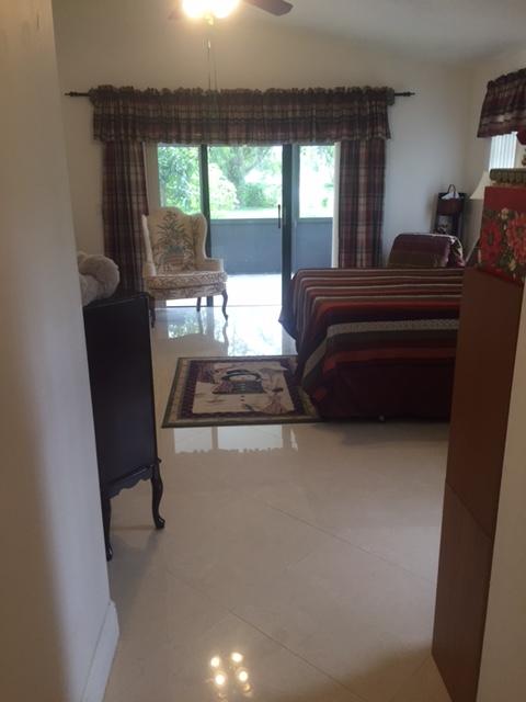 228 Northwest 69th Street Boca Raton, FL 33487 - Photo 15 of 31 a living room with furniture and a large window