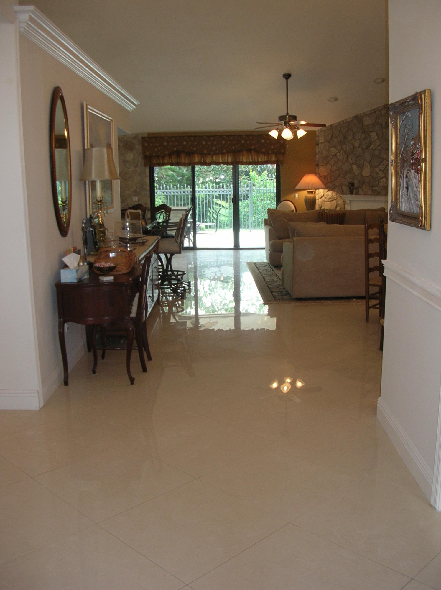 228 Northwest 69th Street Boca Raton, FL 33487 - Photo 2 of 31 a living room with furniture and a large window