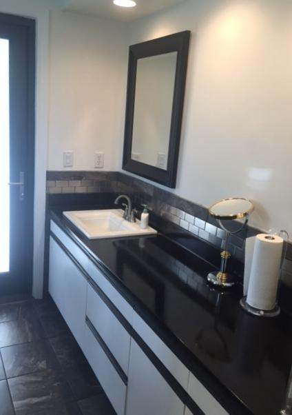 228 Northwest 69th Street Boca Raton, FL 33487 - Photo 23 of 31 a bathroom with a sink and a mirror
