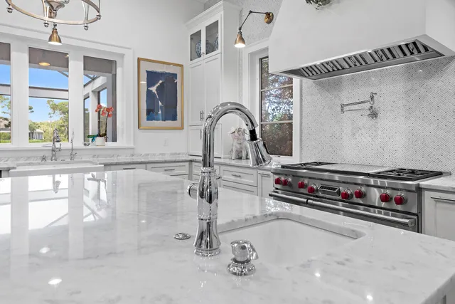 a very nice looking room with a large window and potted plants