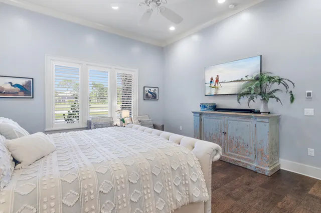 a spacious bathroom with a tub sink toilet and mirror