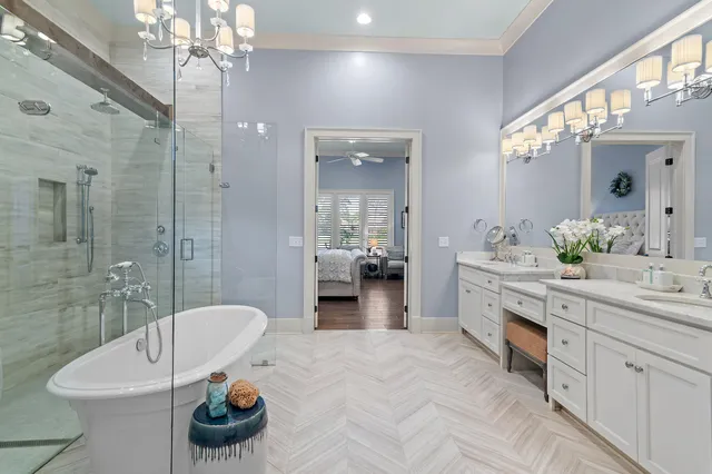 a bathroom with a bathtub shower sink and toilet
