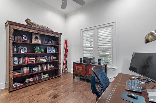 a bathroom with a granite countertop toilet sink and mirror