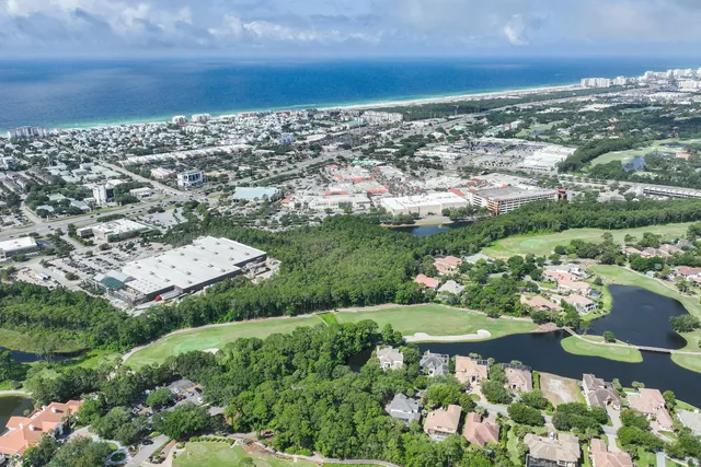 a view of kitchen and center island in wooden floor