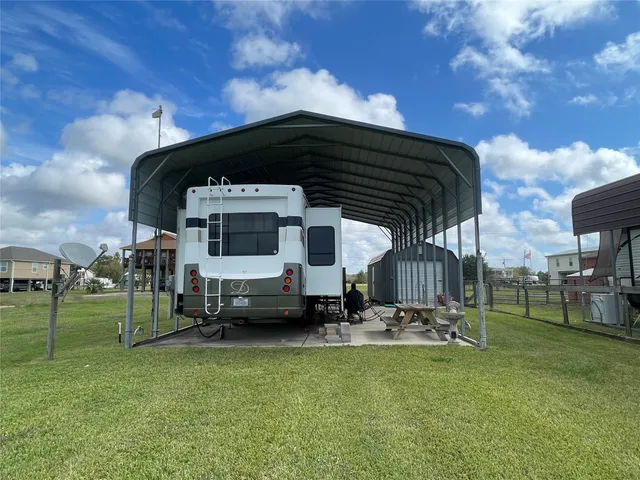 a front view of house with a garden