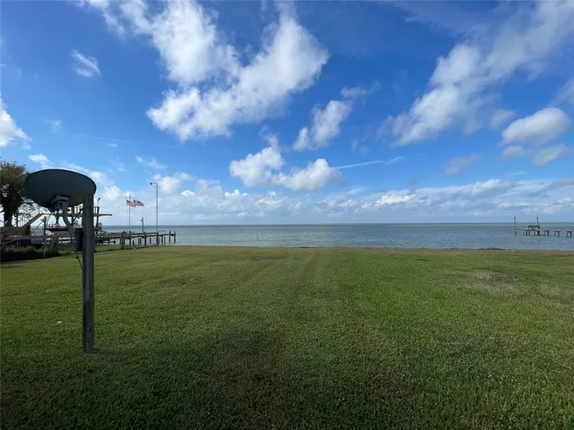 a view of a golf course with a lake