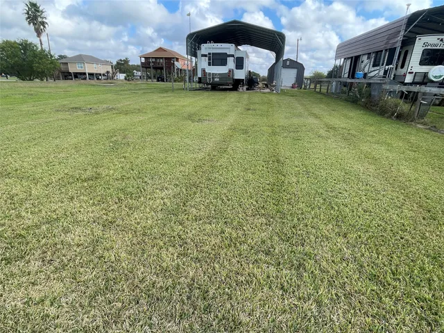 a view of a garden with a house