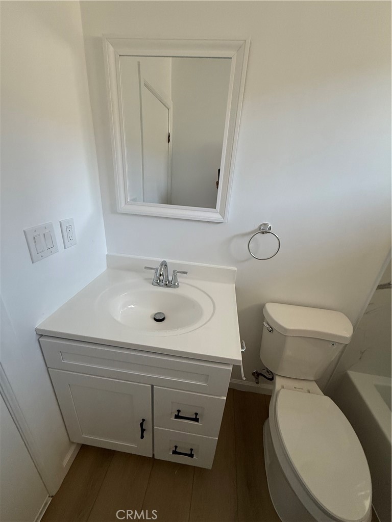7159 Greeley Street, Unit F Tujunga, CA 91042 - Photo 11 of 15 a bathroom with a sink toilet and mirror