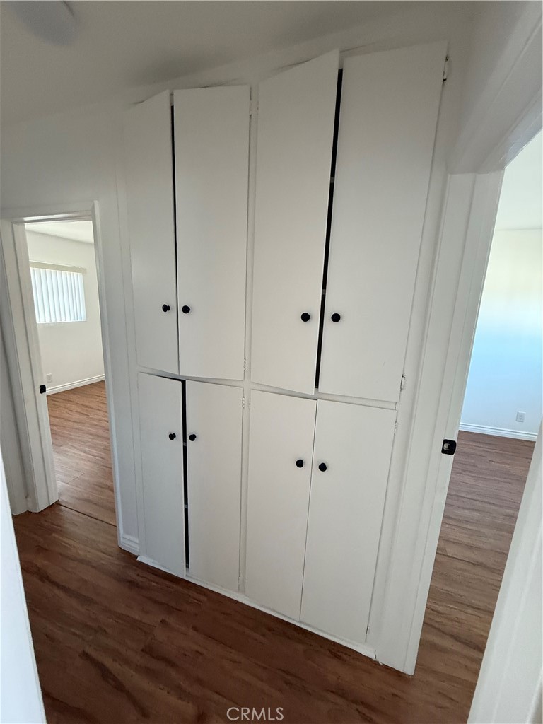 7159 Greeley Street, Unit F Tujunga, CA 91042 - Photo 14 of 15 a view of a hallway with wooden floor