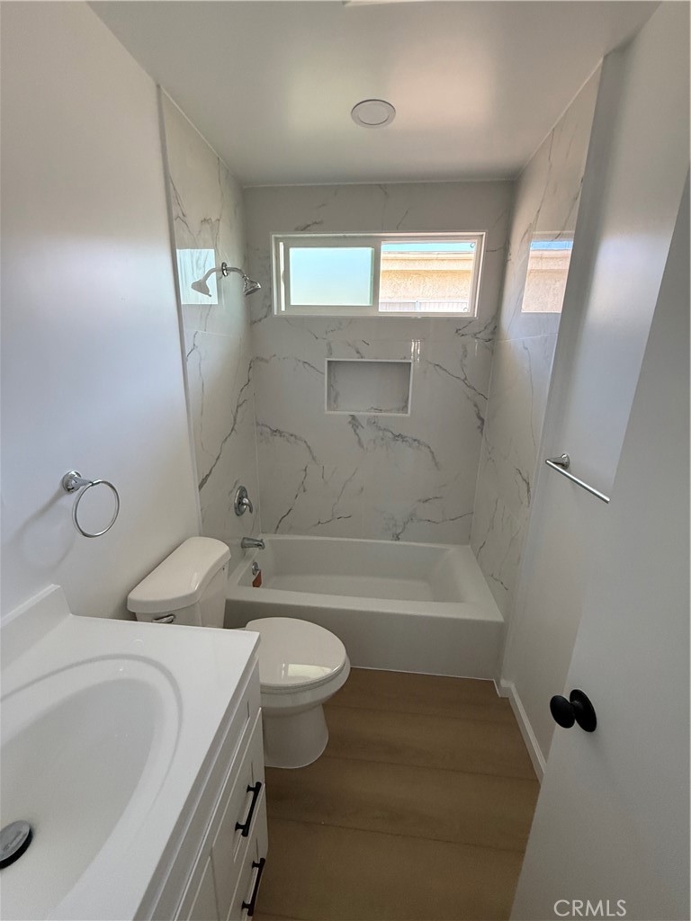 7159 Greeley Street, Unit F Tujunga, CA 91042 - Photo 10 of 15 a bathroom with a sink a toilet and bathtub